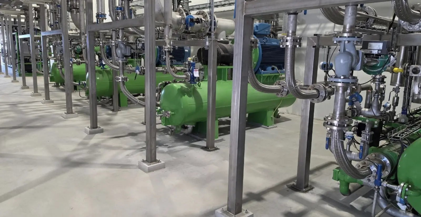 Grouted machine bases and pipework in a process hall