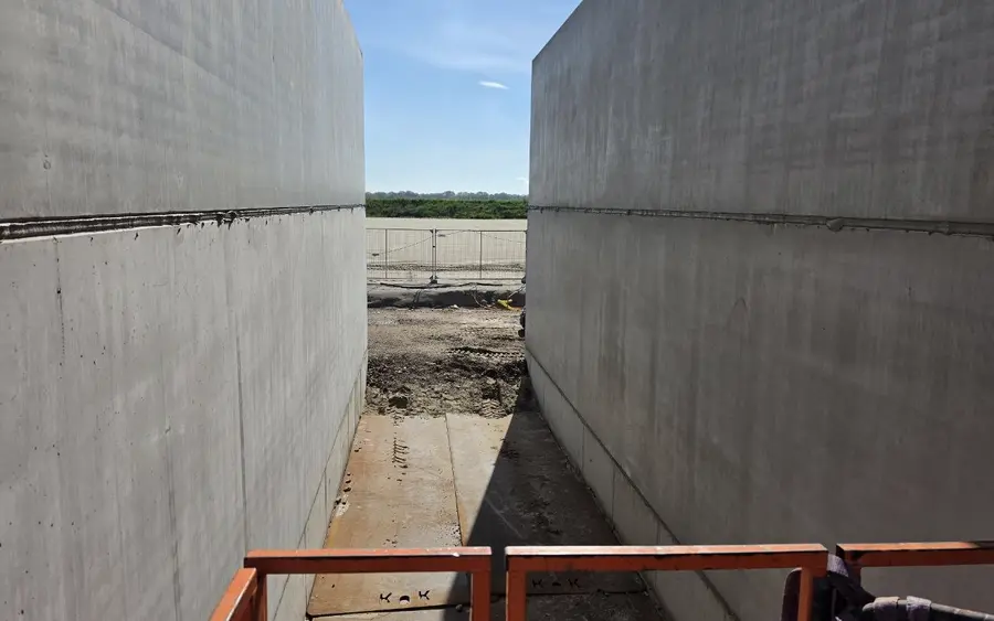 Erected precast wall units with sealed joints